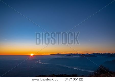 Winter Sunset From An Alpine Peak Of Friuli-venezia Giulia