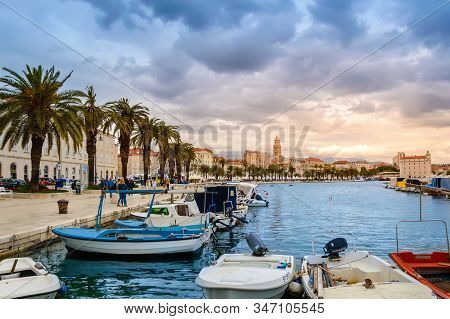 Split, Croatia - May 21, 2019: Beautiful Riva Promenade With Palm Trees Near Matejuska Port With Sma