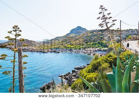 View Of Ladiko Beach With Sun Beds And Sun Shades (rhodes, Greece)