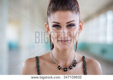 Close Up Portrait Of Beautiful Teen Girl In Dress With Open Shoulders. Glamorous Hairstyle And Elega