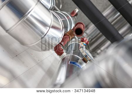 Pipes And Gauge In Heating And Cooling Space. With Out Of Focues Copy Space