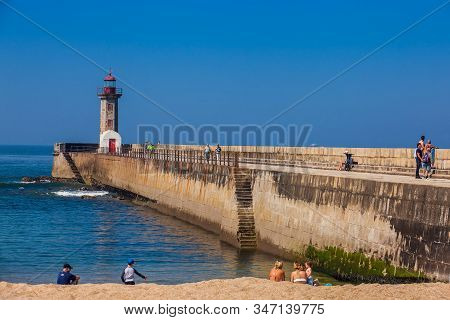 Porto, Portugal - May, 2018: Tourists And Locals Enjoying A Beautiful Early Spring Day At Praia Das 