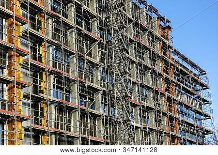 Scaffolding Arround The House To Install Thermal Insulation Of The Apartment Building Facade