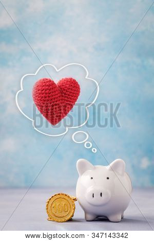 Piggy Bank With Heart And Coins. St. Valentines Day Gift Ideas Concept