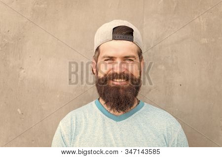 Beard Divides The Boys From The Men. Happy Caucasian Guy Wearing Beard On Grey Wall. Bearded Man Smi