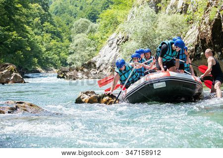 Rafting Team Stucked On The River And Trying To Get Out