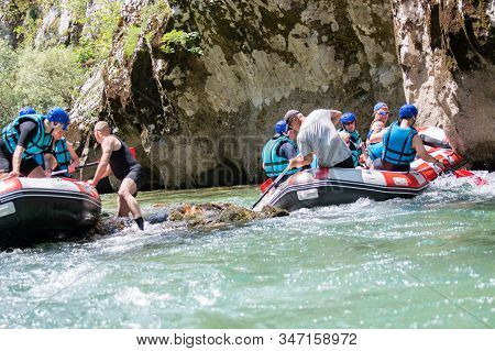 Rafting Team Stucked On The River And Trying To Get Out