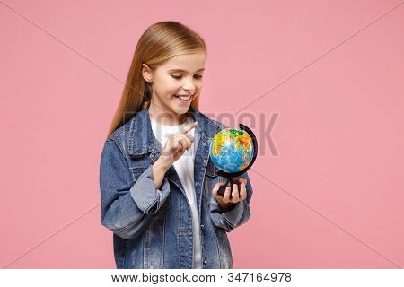 Smiling Little Blonde Kid Girl 12-13 Years Old In Denim Jacket Posing Isolated On Pastel Pink Backgr