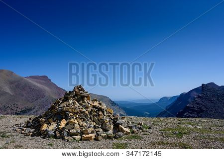 Pile Of Rocks Marks The Summit Of Siyeh Pass In Montana Wilderness