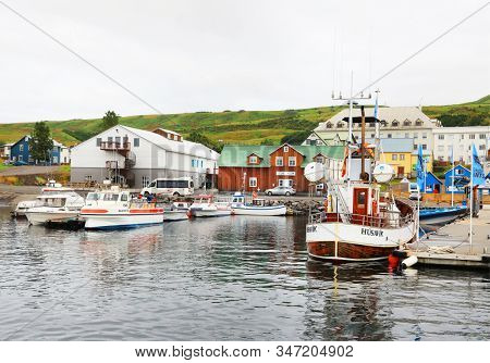 Husavik, Iceland - September 2019: Traditional old wooden fisherman boats used for whale watching in Husavik harbor