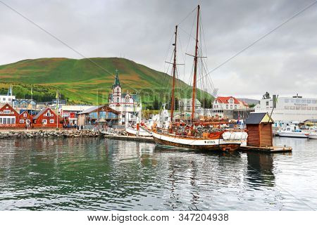Husavik, Iceland - September 2019: Traditional old wooden fisherman boats used for whale watching in Husavik harbor
