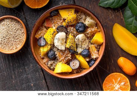 Quinoa Bowl Of Dish. Fresh Quinoa Organic Fruit Salad In Bowl On Wooden  Background. Helthy Superfoo