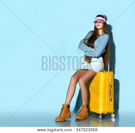 Teen Lady In Jeans Short Overall, Striped Sweatshirt, Yellow Boots, Pink Sun Visor Cap. She Sitting 