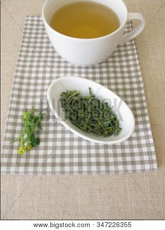 A Cup Of Tea With Dried Hedge Mustard