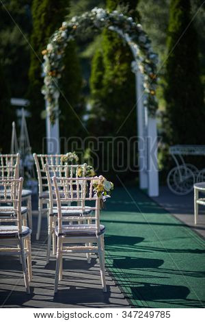 Chairs For Wedding Guests. Wedding Decorations. Flowers
