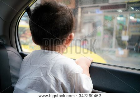 Toddler Baby Boy Looking Outside From Car Throught Mirror