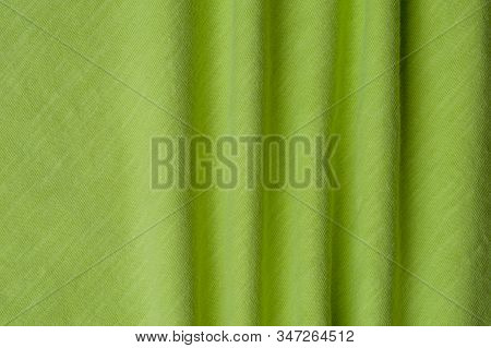 Close-up Fragment Of A Beautiful Yellow Cotton Fabric. Concept Of High-quality Raw Materials For Tai