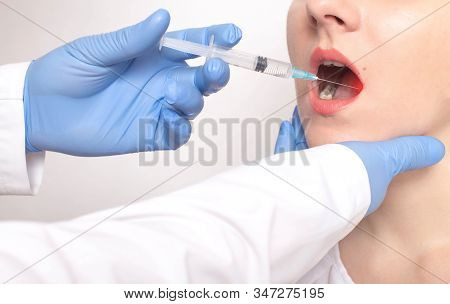 The Doctor Does A Biopsy Of The Tongue With A Syringe In The Patient S Tongue. Concept Check Benign 