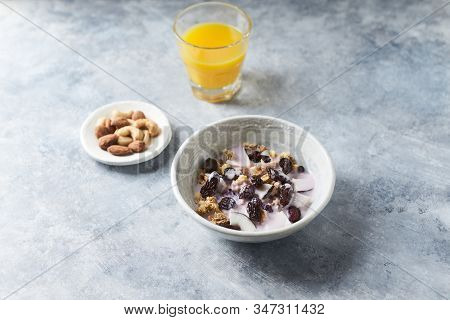 Bowl Of Granola With Yogurt, Nuts, Cranberry And Cocoanut. Concept For A Tasty And Healthy Meal. Sto