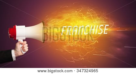 Young girld shouting in megaphone with FRANCHISE inscription, online shopping concept