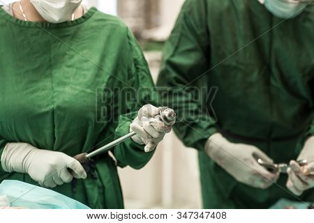 Surgical Team. Sterile Operating Room. Acetabulum Machined By Cutters.