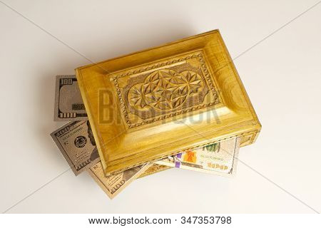 Silver Dollar Banknots In The Treasure Trove, Wooden Chest, Gift, Decoration On Dark Paper Backgroun