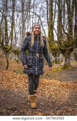 A Young Woman Enjoying In The Otzarreta Forest In The Natural Park Of Gorbea, Bizkaia. Basque Countr