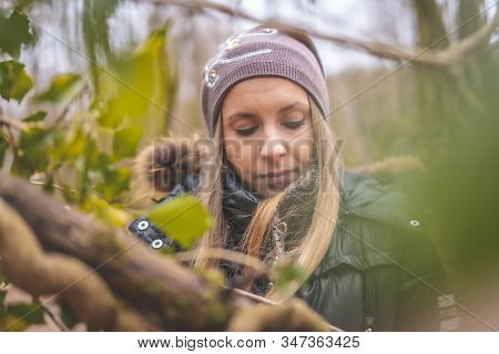 Portrait Of A Young Smiling Blonde Woman Walking In The Otzarreta Forest In The Natural Park Of Gorb