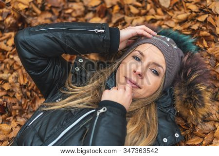 Lifestyle Session, A Blonde Girl Smiling In The Leaves Of The Otzarreta Forest In The Natural Park O