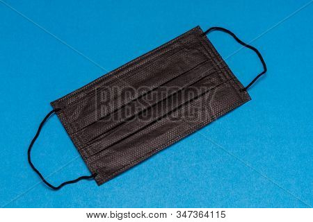 Black Medical Mask On Ear Loops. Disease Prevention.