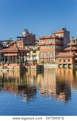 Pimbahal Pokhari Krishna Temple With Reflection In The Pond In Patan, Nepal