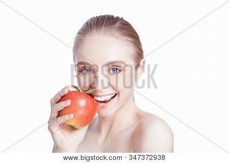 Portrait Of Happy Smiling Young Beautiful Woman Eating Red Apple, Over White Background