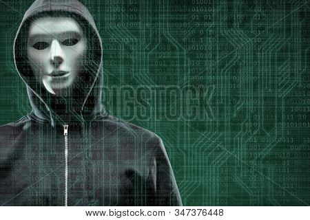 Anonymous computer hacker over abstract digital background. Obscured dark face in mask and hood. Data thief, internet attack, darknet fraud, dangerous viruses and cyber security.