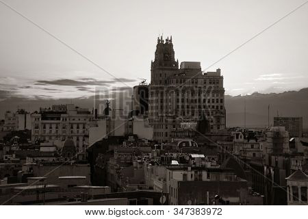 MADRID, SPAIN - MAY 13, 2018: Telefonica Building rise above historical buildings on Gran Via business district.