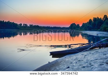 Tranquil And Peaceful Picturesque Landscape Of The Pripyat River With Wooden Boat At Foreground. Lak