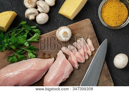 Slicing Chicken Breast Fillet For Cooking With Champignons And Cheese, Top View