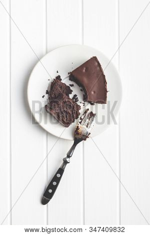 Chocolate brownies cake on white table.