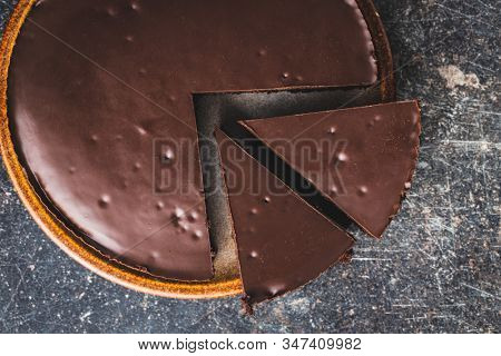 Chocolate brownies cake on old kitchen table.