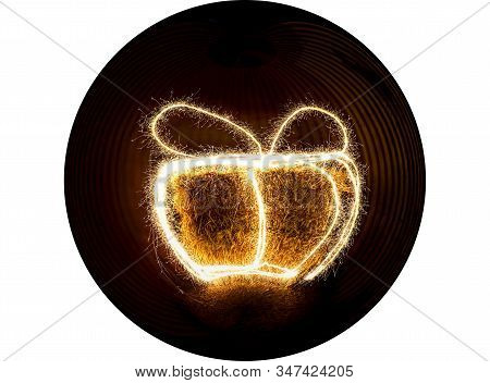 Round Shape Of A Hay Bale Painted With Light To Resemble A Gift