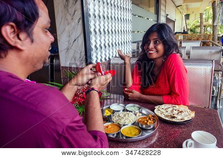 Amased And Surprised Indian Woman Feeling Happy To Get Proposal From Her Boyfriend In Restaurant. I 