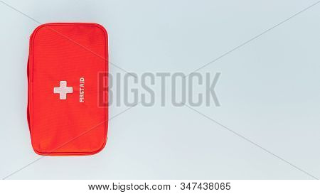 Red Bag With Home First Aid Kit. Box For Various Medicines, Vitamins, Drugs, Antibiotics And Other M