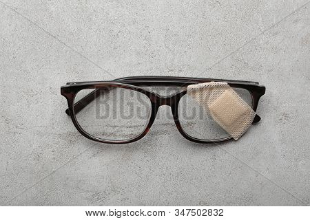 Glasses With Sticking Plaster On Light Grey Stone Table, Top View