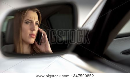 Woman Talking On Phone While Driving, Inattentive On Road, Rearview Mirror