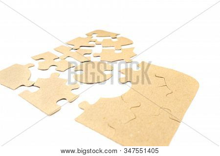 Pieces Of Cardboard Puzzles Isolated On White Background