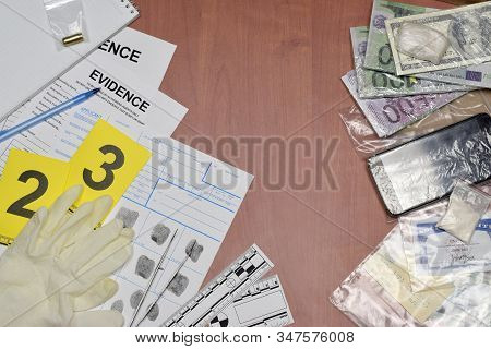 Paperwork During Crime Scene Investigation Process In Csi Laboratory. Evidence Labels With Fingerpri