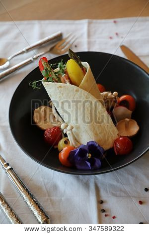 Shaverma Fruit Roll With Vegetables And Fruit And Sauce