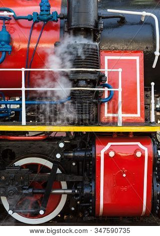Old Steam Locomotive Blowing Off The Steam Out Of The Whistle.