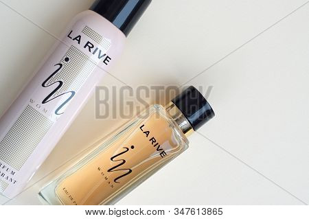 La Rive In Woman Deodorant And Perfume Bottles On Beige Background. La Rive S.a. Is One Of The Leadi