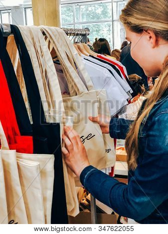 Girl Choosing Personal Fabric Shopping Tote Bag On Local Market Eco Shop. Zero Waste And Pastic Free