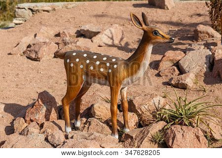 Katta Turk, Uzbekistan - October 18, 2019: Statue Of A Young Sika Deer On The Side Of The Road.